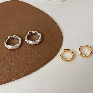 Minimalist twisted metal hoop earrings set in gold and silver finish for women fashion jewelry