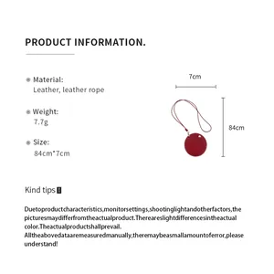 Detailed view of leather cord necklace with 84cm length and 7cm round pendant