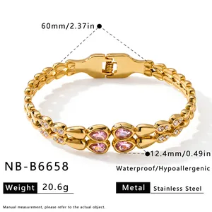 Detail view of gold stainless steel bracelet with pink teardrop zircons and measurements