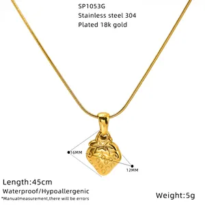 Close-up detail view of 18k gold plated strawberry pendant necklace with dimensions