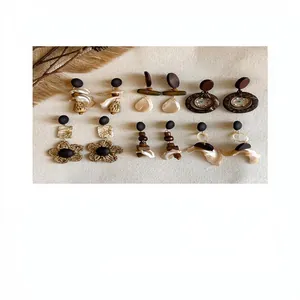 Detailed macro view of vintage Bohemian wooden and shell drop earrings in retro style