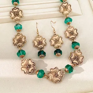 Vintage flower jewelry set with green resin beads and gold-tone metal rose necklace