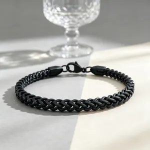 Close-up of 3mm black stainless steel wheat chain bracelet with matte finish