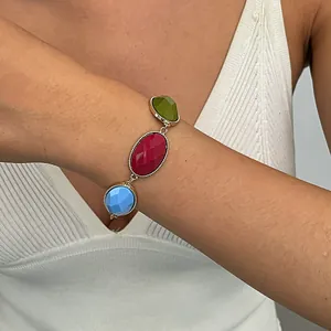 Detailed macro view of a vintage metal resin oval geometric bracelet on the wrist