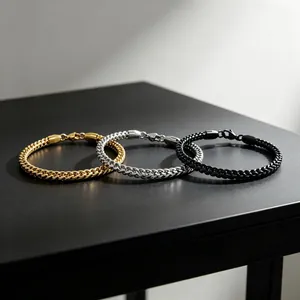 Detailed view of 3mm stainless steel franco link bracelets in gold, silver, and black