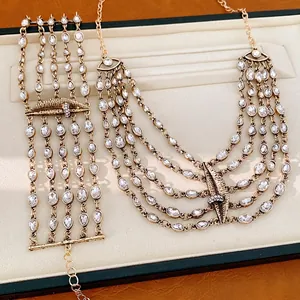 Exaggerated lips motif rhinestone necklace and bracelet set in vintage gold finish