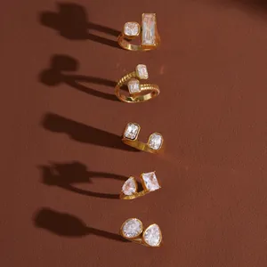 Detailed view of geometric 18K gold plated stainless steel rings with sparkling cubic zirconia