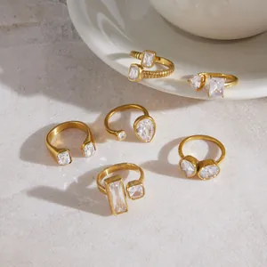 Collection of gold-plated titanium steel rings with geometric cubic zirconia stones