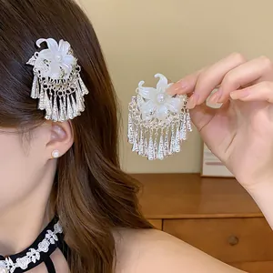 Detailed view of New Chinese-style hair clip with pearl flower and elegant silver tassels