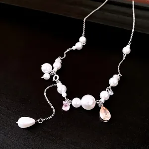 Elegante Perlenkette mit rosa und champagnerfarbenen Kristallen und Quastenanhänger