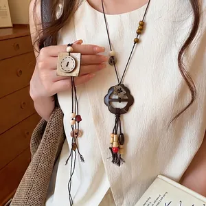 Collier Pendentif Bouton Fleur en Coque de Noix de Coco Style Ethnique Rétro Femmes Chaîne Longue de Pull Bijoux Faits Main