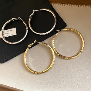 Western style hammered circular hoop earrings in gold and silver finish