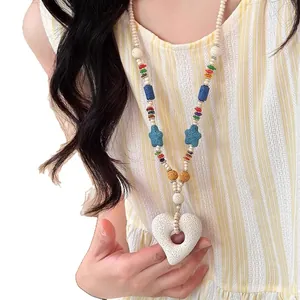 Colorful beaded lava stone necklace with heart pendant and starfish accents for beach wear