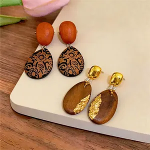 Vintage handmade wood oval drop earrings with floral patterns and luxury gold foil details