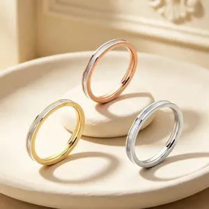 Close-up detail of 2mm stainless steel rings with mother-of-pearl inlay in three colors