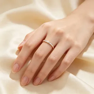 Close-up of 2mm stainless steel ring with mother of pearl inlay on finger