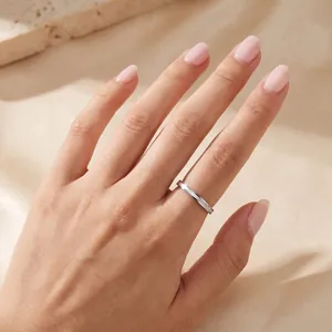 Close-up of a 2mm stainless steel ring with elegant mother of pearl inlay worn on finger