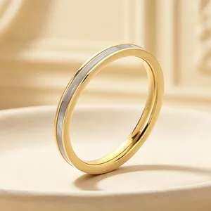 Close-up detail of 2mm gold-plated stainless steel ring with white shell inlay