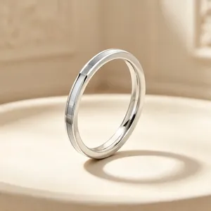 Detailed close-up of a 2mm stainless steel ring with white mother-of-pearl inlay