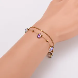 Close-up of double-layer stainless steel bracelet with colorful starfish and droplet beads