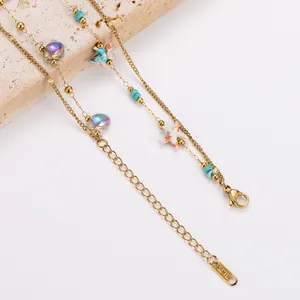 Close-up of double-layer stainless steel bracelet with colorful starfish and beads
