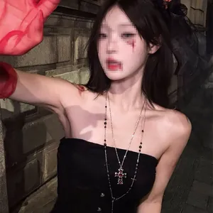 Double-layer beaded necklace with red cross pendant shown on a model