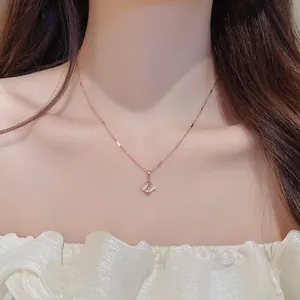 Close-up of elegant cat's eye stone necklace with geometric rhombus pendant detail