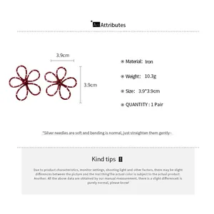 Detailed view of red polka dot hollow flower earrings with size and material specifications