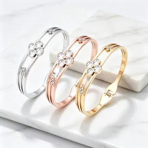 Elegant three-color stainless steel bracelets featuring delicate crystal lucky clover charms