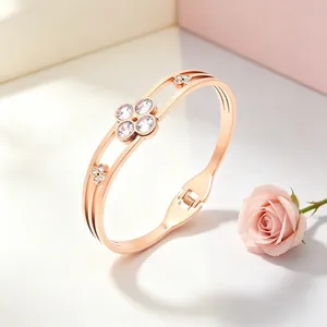 Macro detail of rose gold stainless steel clover bracelet with sparkling crystals
