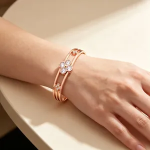 Rose gold stainless steel clover bangle with sparkling gemstones for women