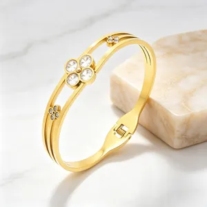 Elegant gold stainless steel bangle with sparkling zircon clover motifs for women's gift