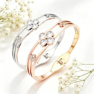 Detailed close-up view of rose gold and silver clover bangles with clear cubic zirconia stones
