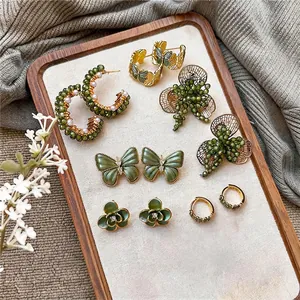 Elegant forest style green butterfly and flower earring set with pearls and gold accents