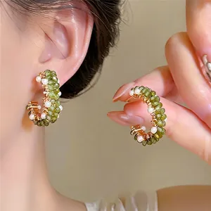 Handmade green beaded C-shaped hoop earrings with pearls for elegant styling