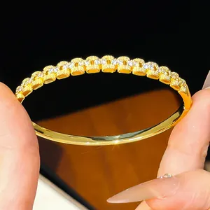 Detailed view of an elegant 18K gold plated bangle adorned with sparkling cubic zirconia