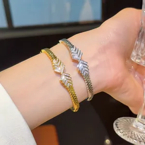 Close-up of 18K gold plated zircon bracelets with elegant chevron pattern on wrist