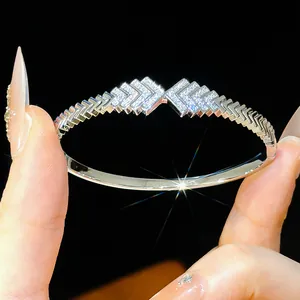 Detail of 18K gold-plated geometric bangle with sparkling pavé zircons