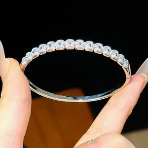 Detailed close-up of 18K gold plated silver hinged bangle with paved cubic zirconia