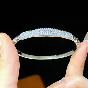 Close-up of elegant 18K gold plated bangle with shimmering pavé set cubic zirconia