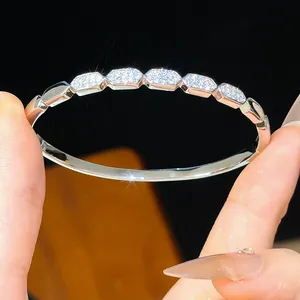 Close-up of 18K gold plated bangle featuring sparkling pavé-set cubic zirconia