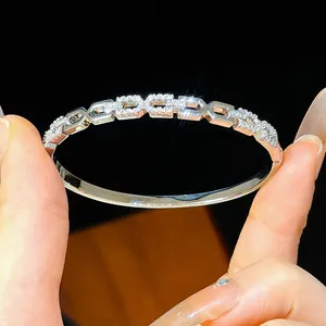 Detail shot of sparkling zircon encrusted links on a gold plated bracelet.