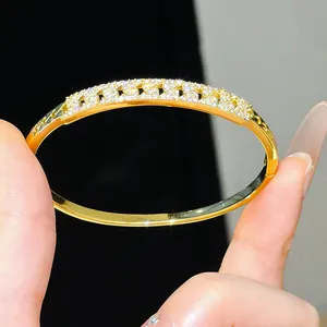 Close-up of luxury 18K gold plated bangle bracelet with sparkling micro-pave zircon stones