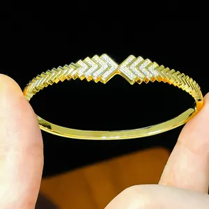 Detailed macro view of 18K gold plated bangle featuring sparkling cubic zirconia stones