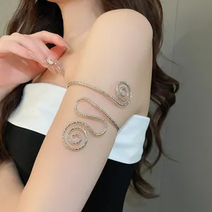 Close-up of a silver twisted metal spiral upper arm cuff on a model's arm