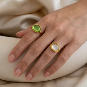 French retro style gold-plated stainless steel rings with green and white oval gemstones