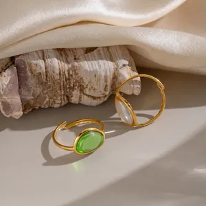 French vintage style stainless steel open rings featuring green and white oval gemstones