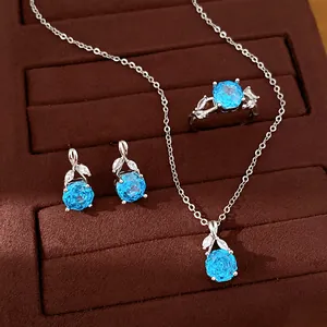 Detailed view of an elegant blue zircon flower pendant necklace, earrings, and ring jewelry set