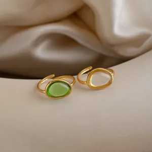 Detailed macro view of French vintage stainless steel rings with green and white gemstones