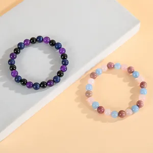 Bracciali di perle in cristallo curativo naturale in diverse tonalità scure e pastello